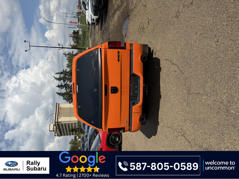 Orange 2015 RAM 1500 Pickup Truck Four-Wheel Drive Automatic